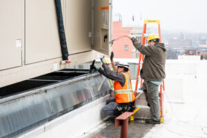 Steele Electric Master Electrician and Apprentice Electrician conduct Portland Oregon rooftop industrial HVAC installation.
